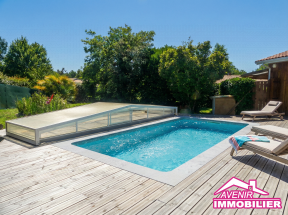 Piscine enterrée et terrasse bois exposée sud maison Lacanau